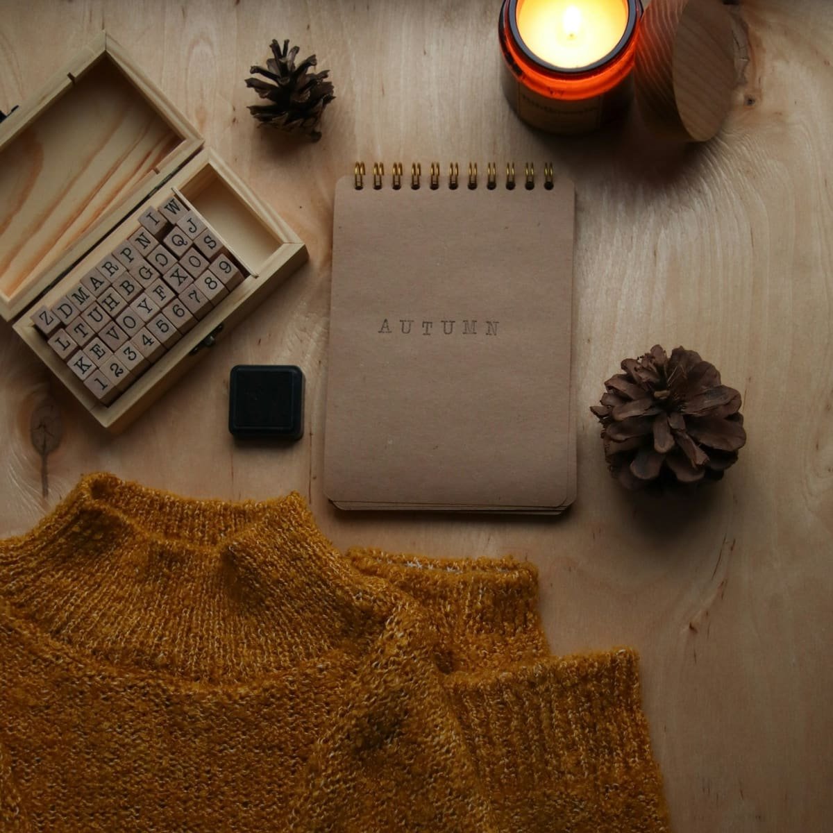 A notebook and products laid out on a table